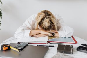 Woman with head on desk